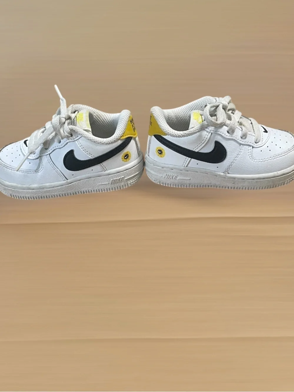Nike Toddler White Sneakers with Black Swoosh and Yellow Star